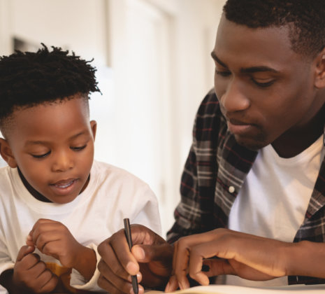 a man teaching the kid