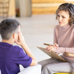 boy talking to a professional