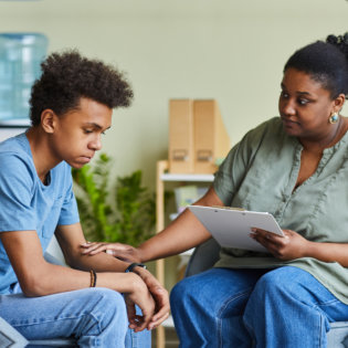 teenager talking to a specialist