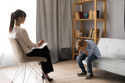 Boy talking to a professional
