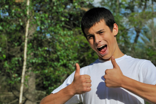 Boy giving a thumbs up